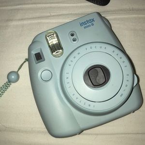 blue polaroid camera